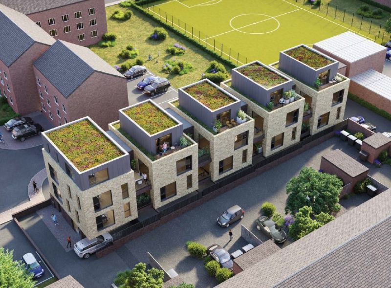 Aerial view of the consented Surbiton scheme: a terrace of contemporary townhouses with green sedum roofs, arranged on backland behind an existing parade